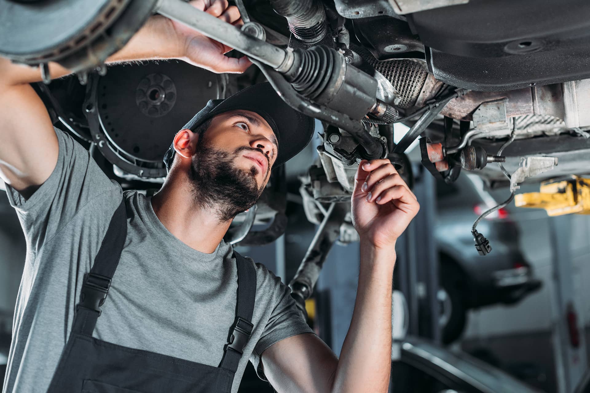 mechanic-in-overalls-repairing-car-in-auto-repair-2022-12-16-18-39-34-utc.jpg
